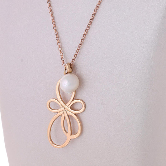 Pendentif en or avec note musicale et perle de culture